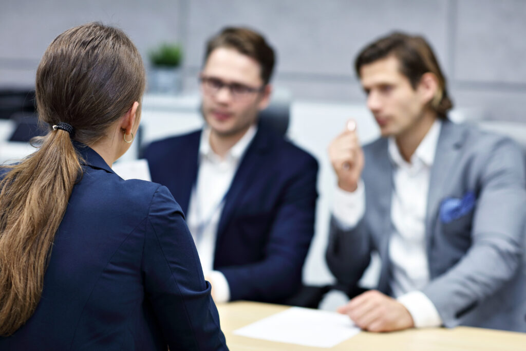 Female arbitrator talking to clients